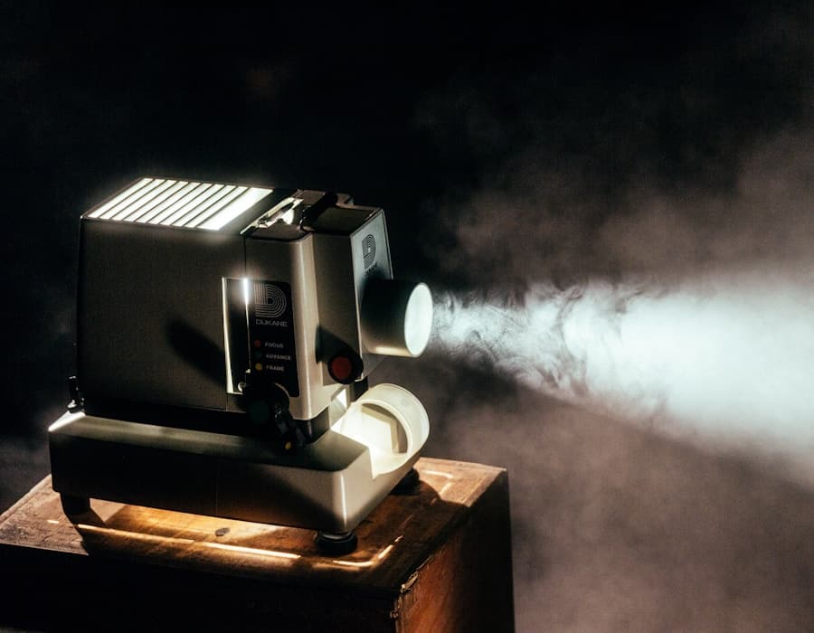 Cinematic film projector light cutting through a dark movie theater